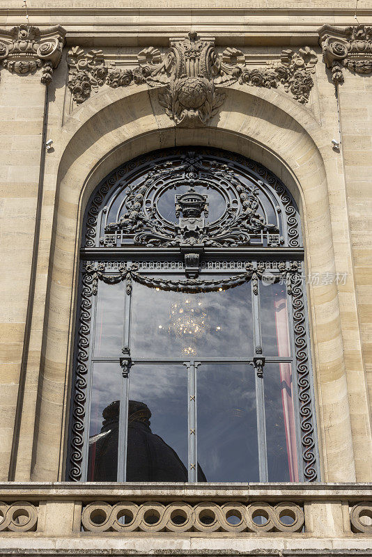 architectural detail of the tower of the Chamber of Commerce in the French city of Lille on the Place du Théâtre. The building was built between 1910 and 1921 and was designed by architect Louis Marie Cordonnier